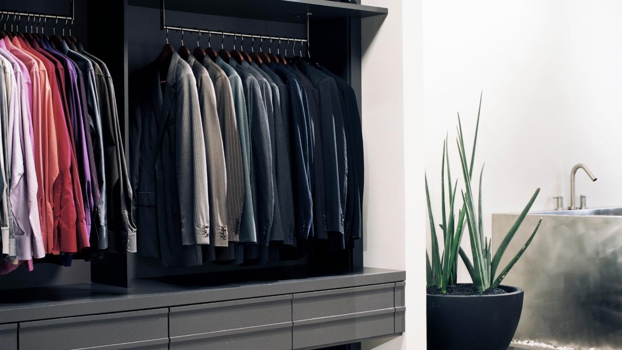 Business suits in mans-wardrobe designed by AS Fitted Wardrobes and Interiors